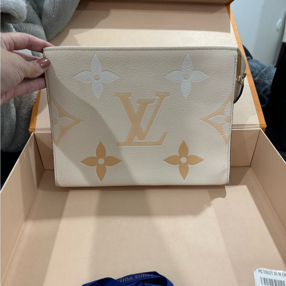 LOUIS VUITTON Creme Monogram Empreinte Leather Pool Poche Toilette 26 Pouch